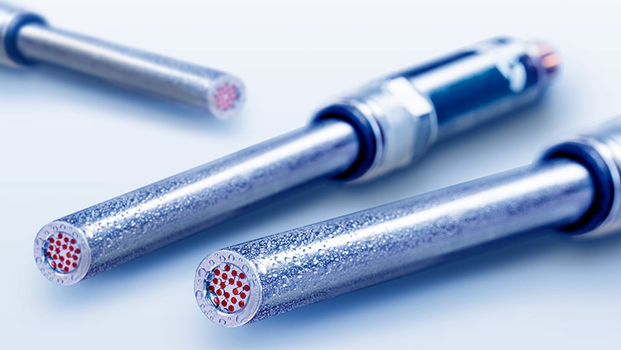Three metal sensor probes with red dot arrays on their end faces, shown on a light background.