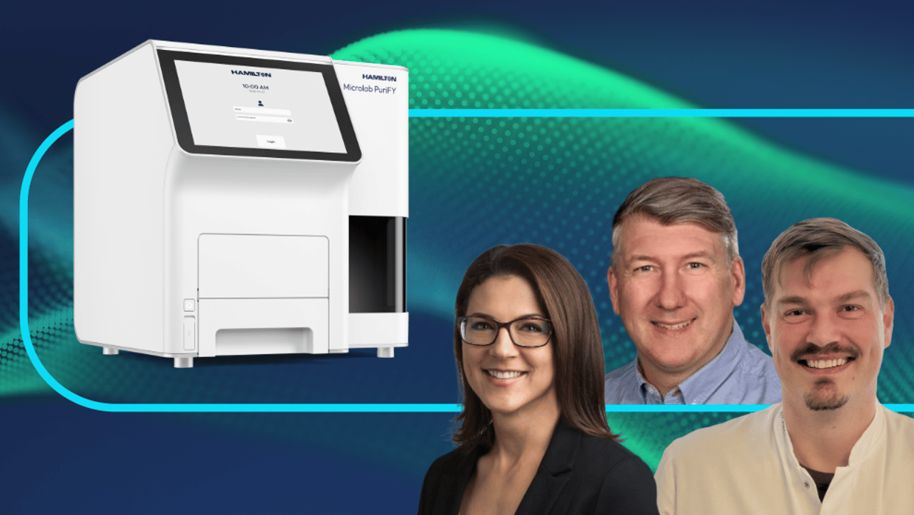 Hamilton Microlab PuriFY instrument beside three smiling people against a teal and dark blue background.