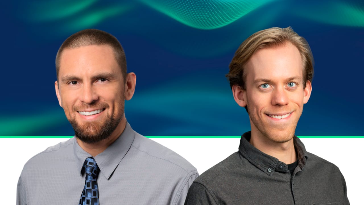 Two professionals smiling, posed against a blue and teal wave graphic background.