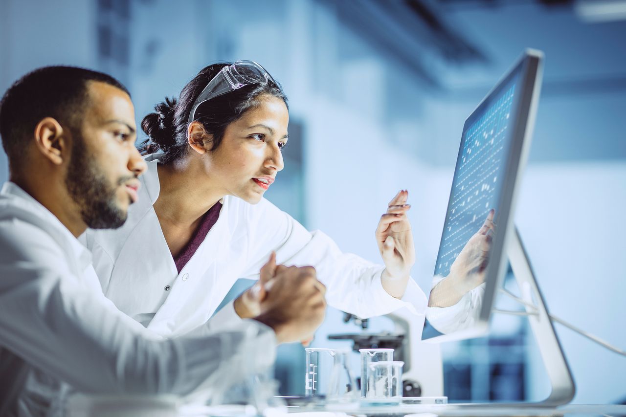 Scientists monitoring in a lab