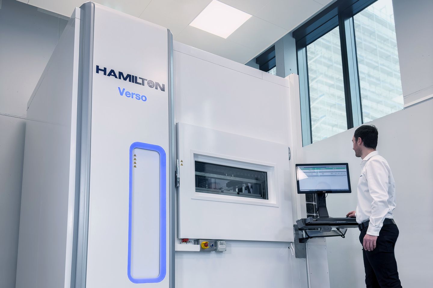 Lab tech interacting with Hamilton Verso