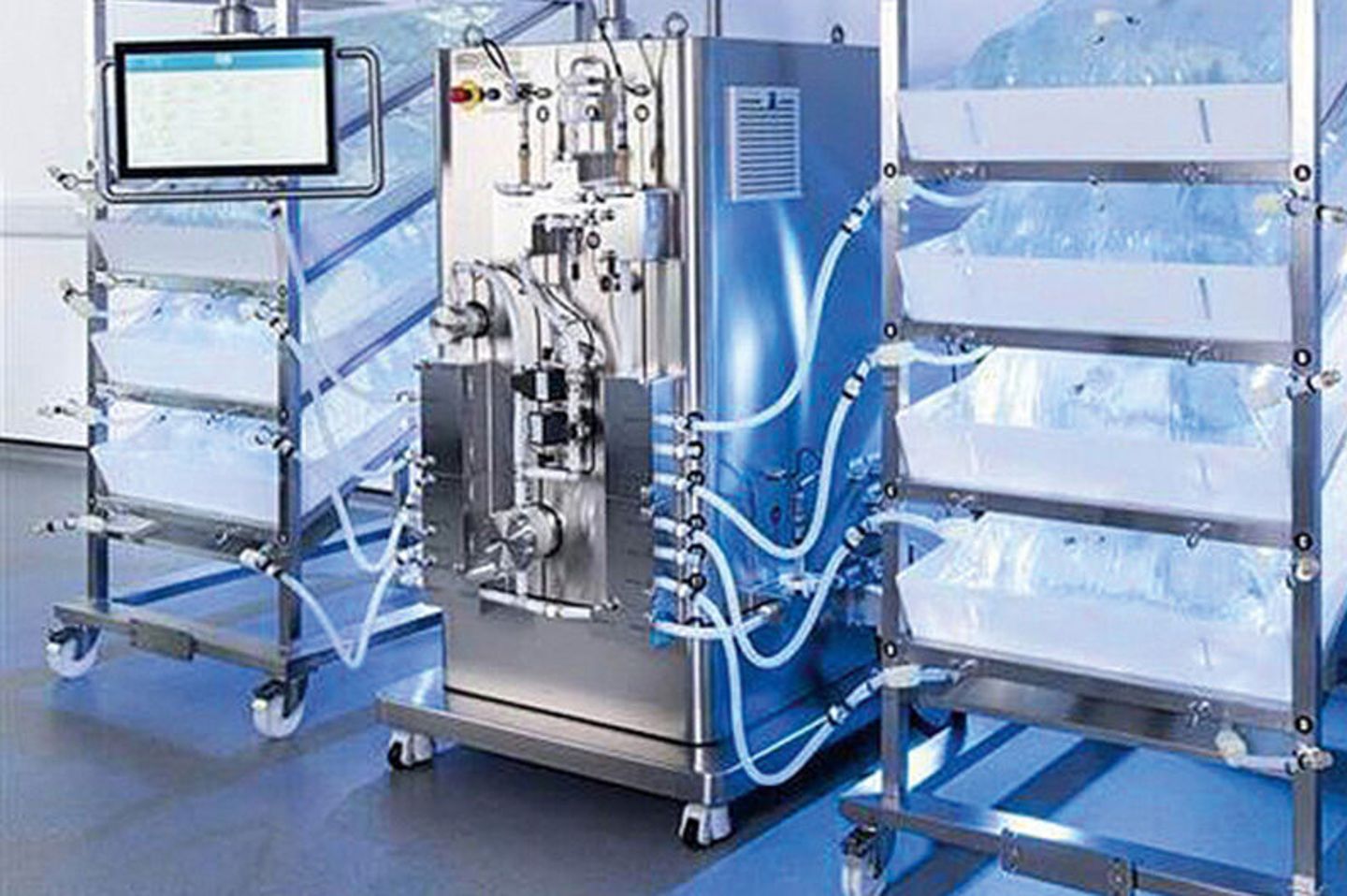 Stainless steel bioreactor dilution system with tubing connections, single-use bioprocess bags on racks, and touchscreen controller
