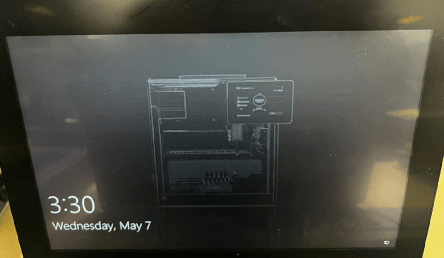 Windows lock screen displaying 3:30 Wednesday May 7, with a schematic illustration of a desktop PC tower