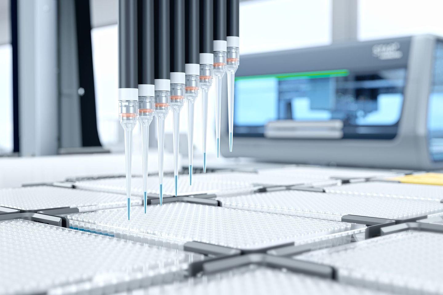 Multi-channel pipette head dispensing blue liquid into a 384-well microplate on an automated liquid handling system