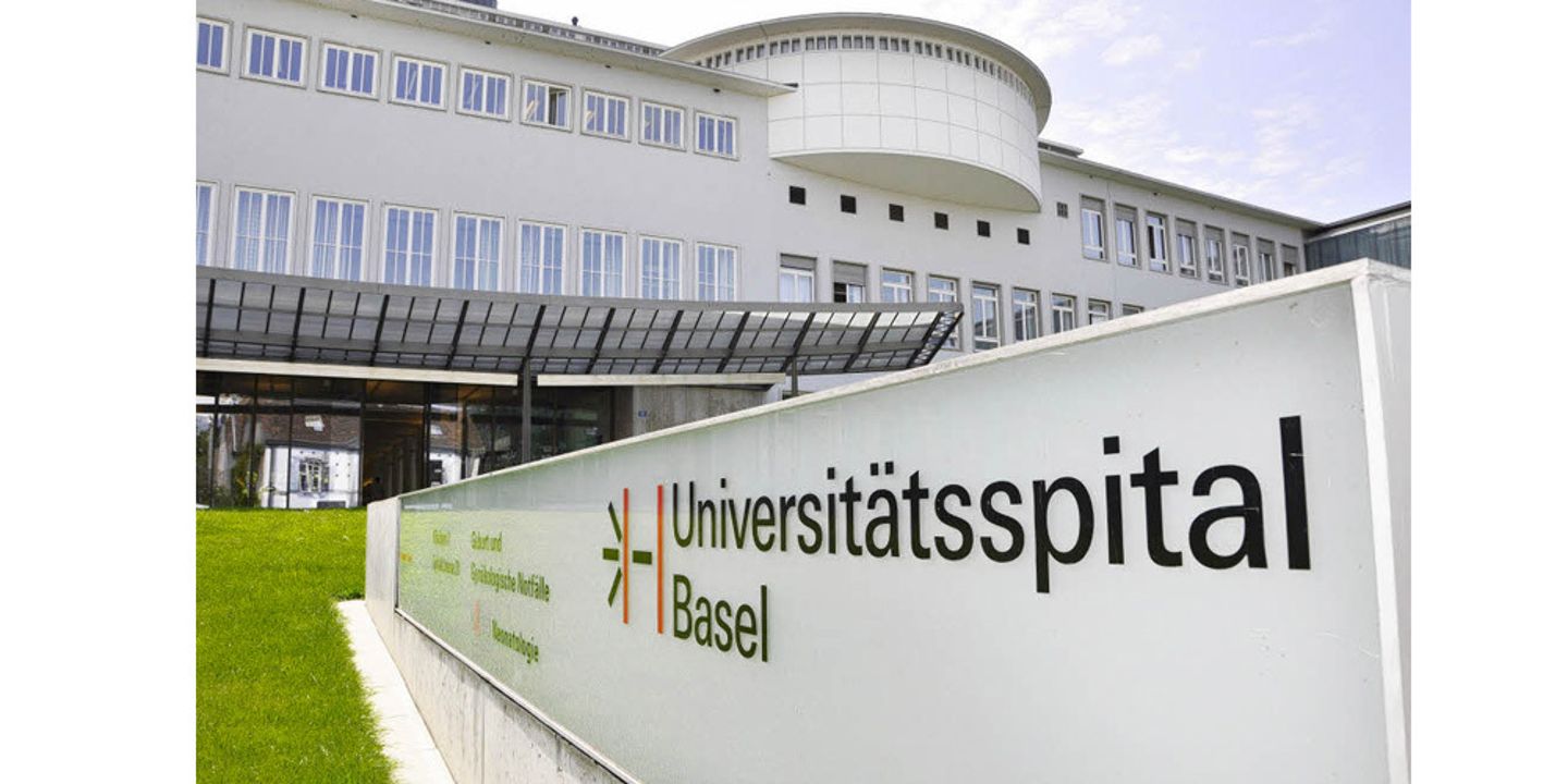 Exterior of Universitätsspital Basel university hospital building with signage in foreground