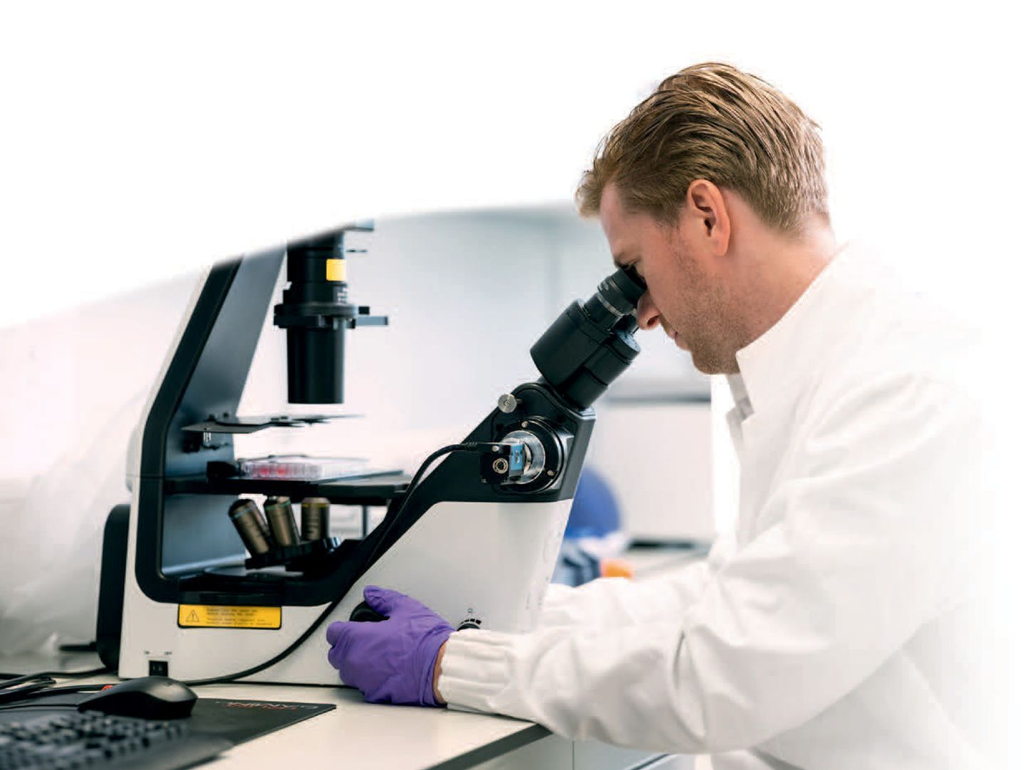 Scientist examining cultivated meat