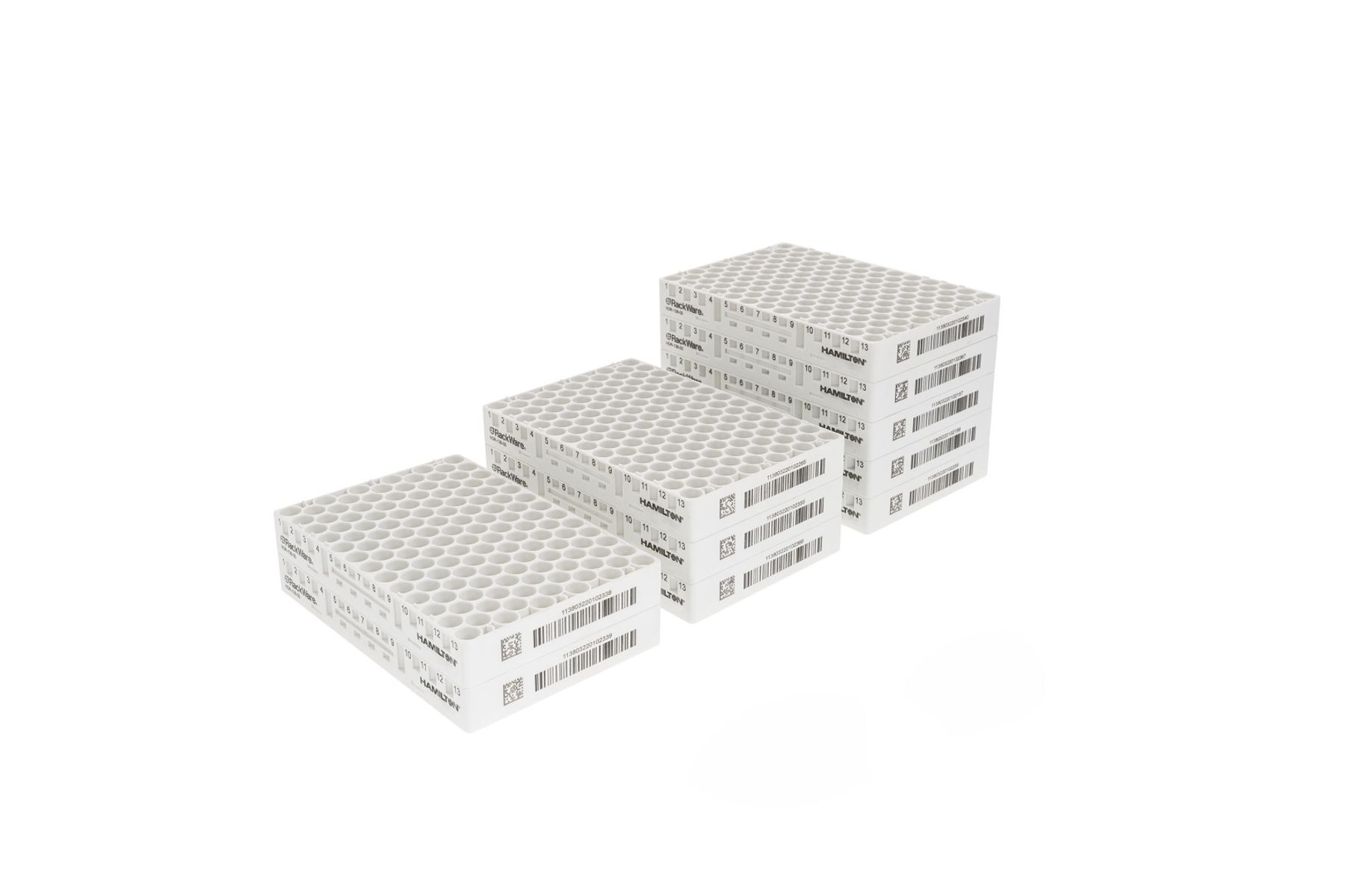 White Hamilton RackWare sample storage racks stacked in groups of 2, 4, and 6, with barcodes and grid labels visible.