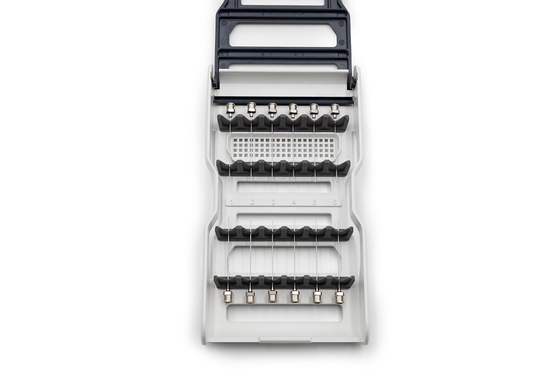 Syringe guard tray with two rows of six needles secured in foam-padded holders, numbered 1–6