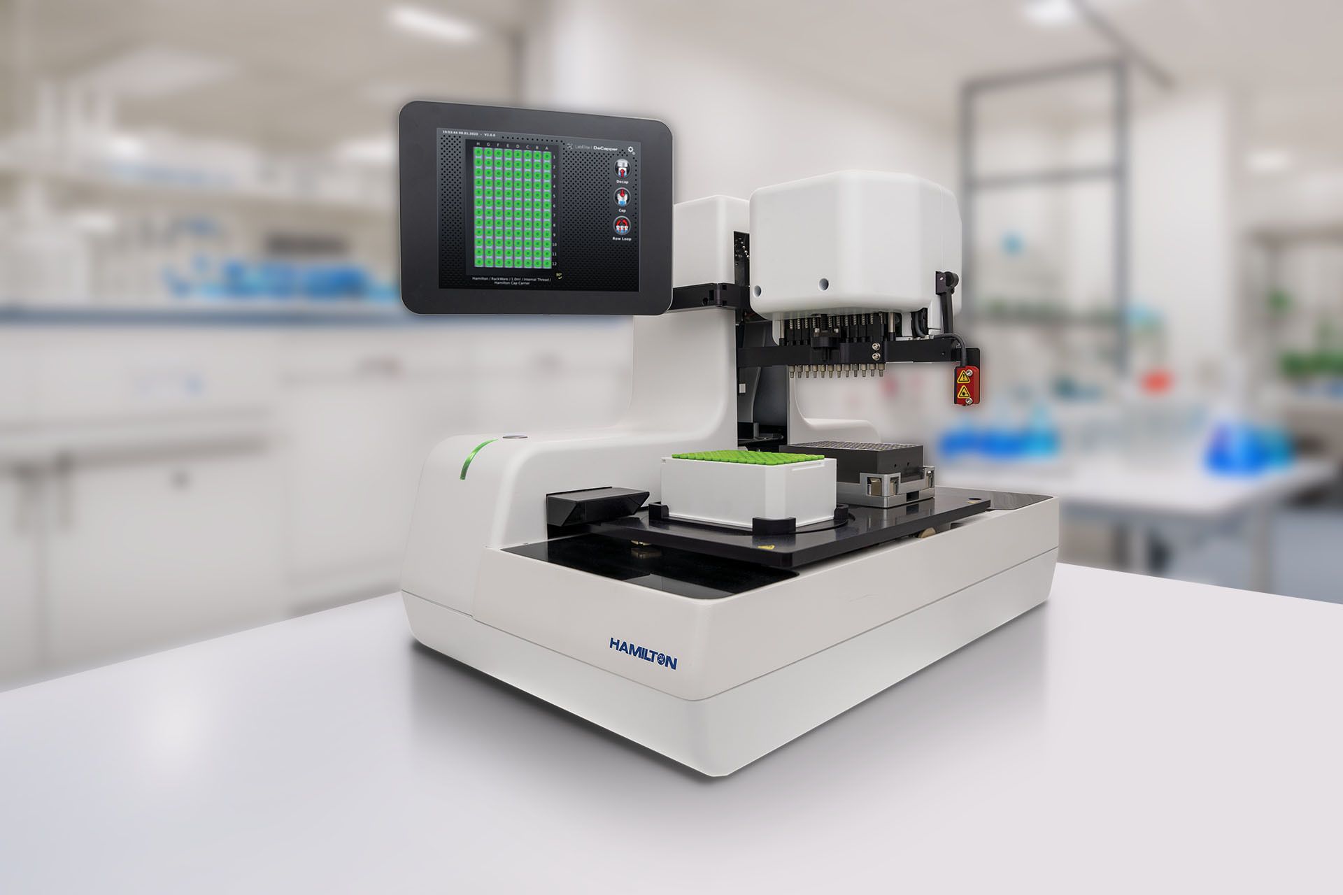 Hamilton benchtop automated capper instrument with touchscreen display and green-capped sample rack