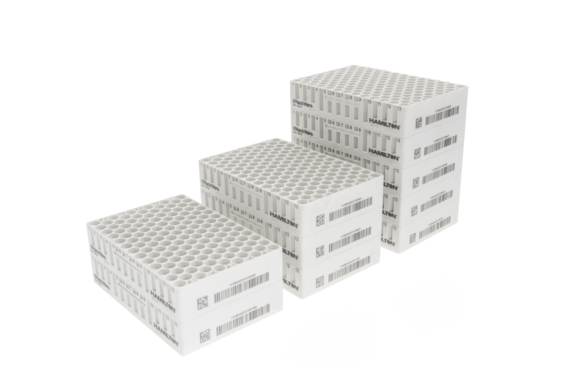 Three white Hamilton RackWare sample storage racks stacked in ascending tiers, showing tube wells and barcode labels.