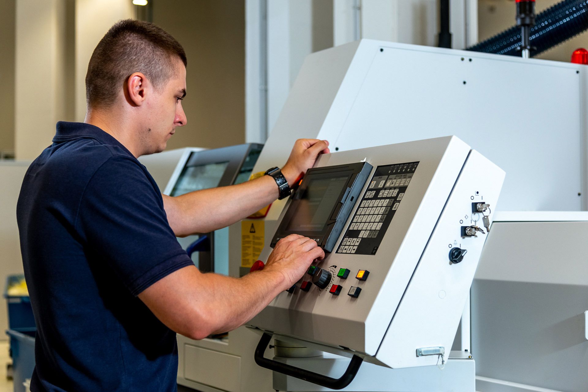 Hamilton employee at CNC equipment