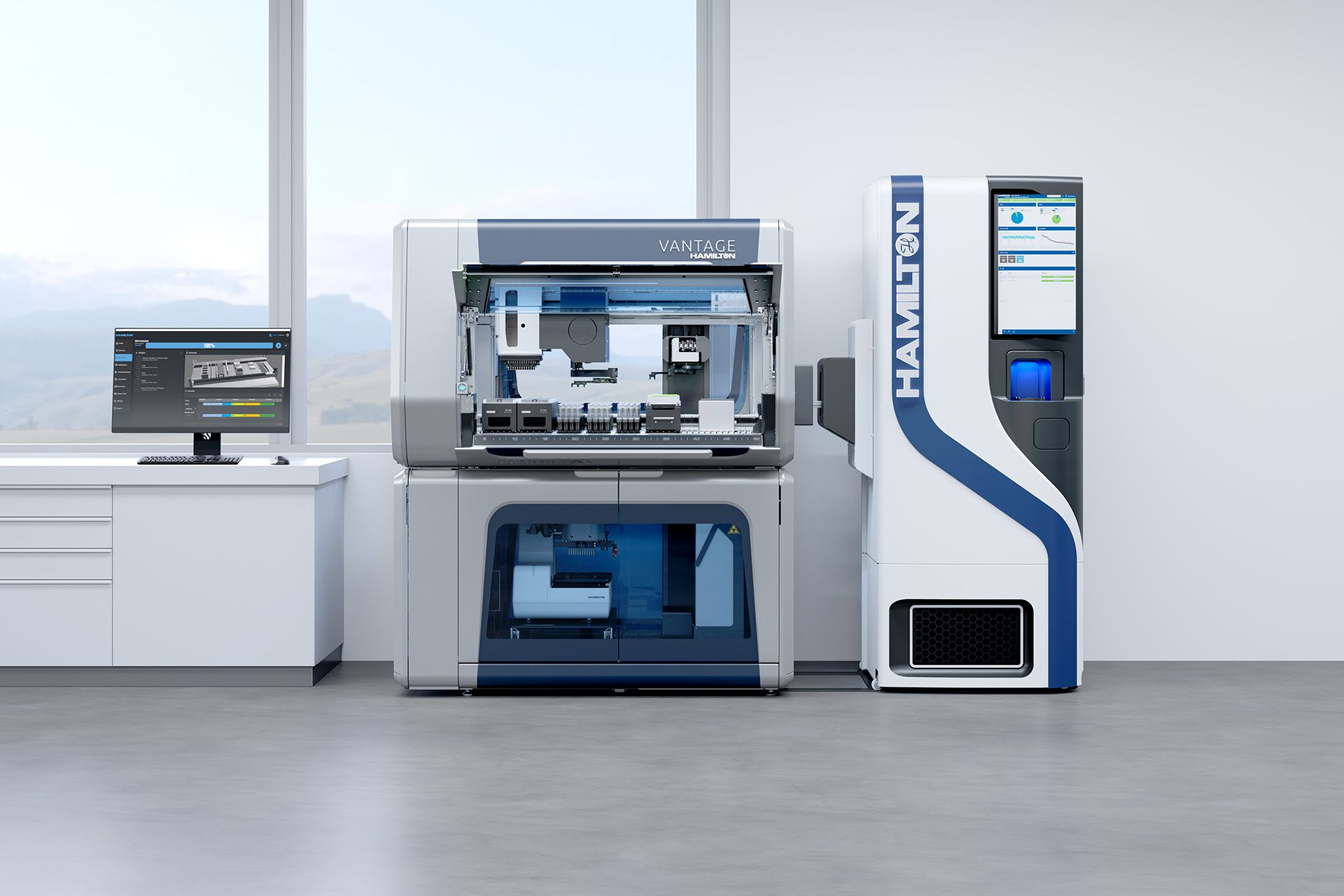 Hamilton Vantage automated liquid handler with open deck beside a Hamilton sample storage tower and a control monitor