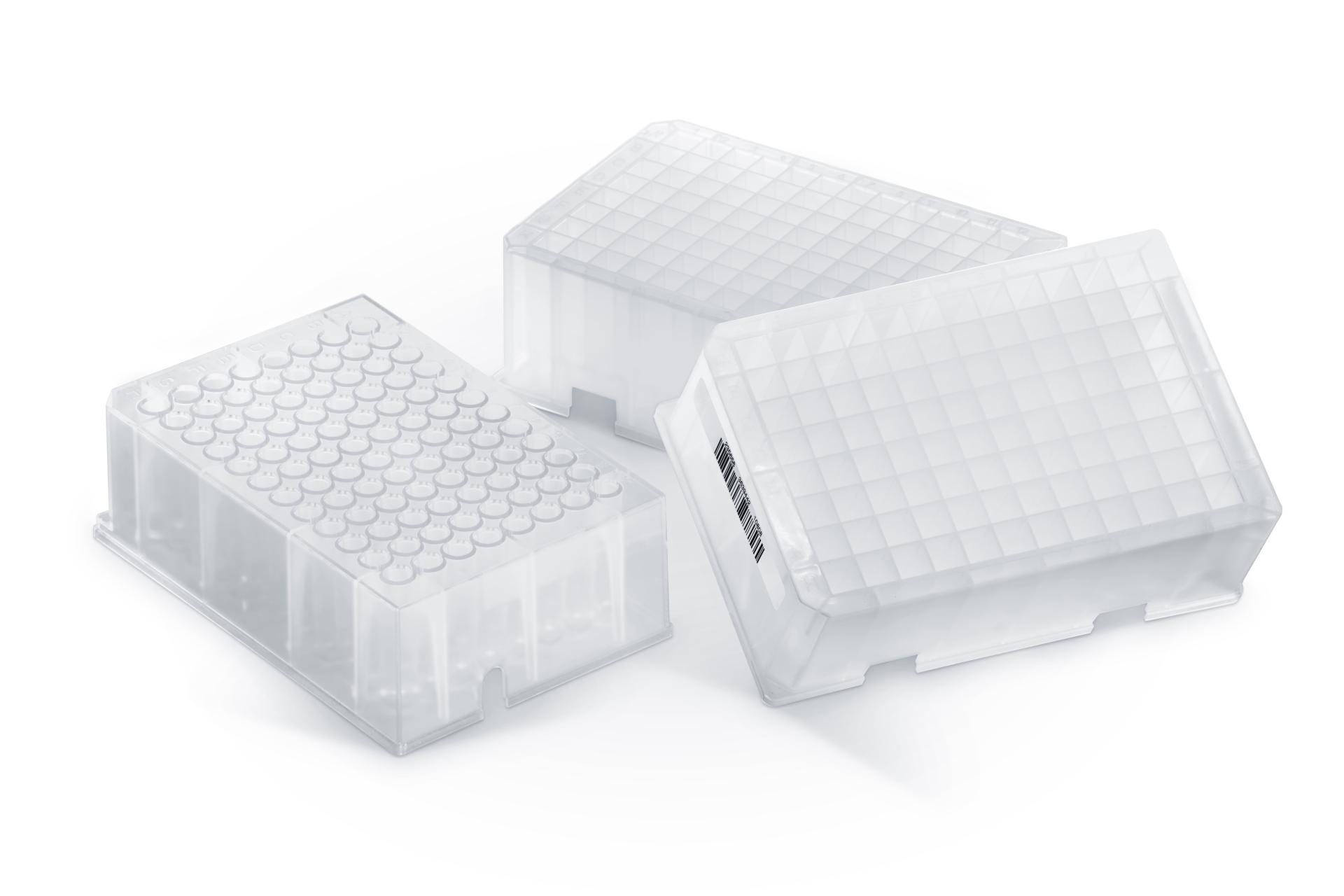 Three translucent polypropylene deep well plates, one sealed with a round-well cap mat and two with flat grid sealing mats, one with a visible barcode label