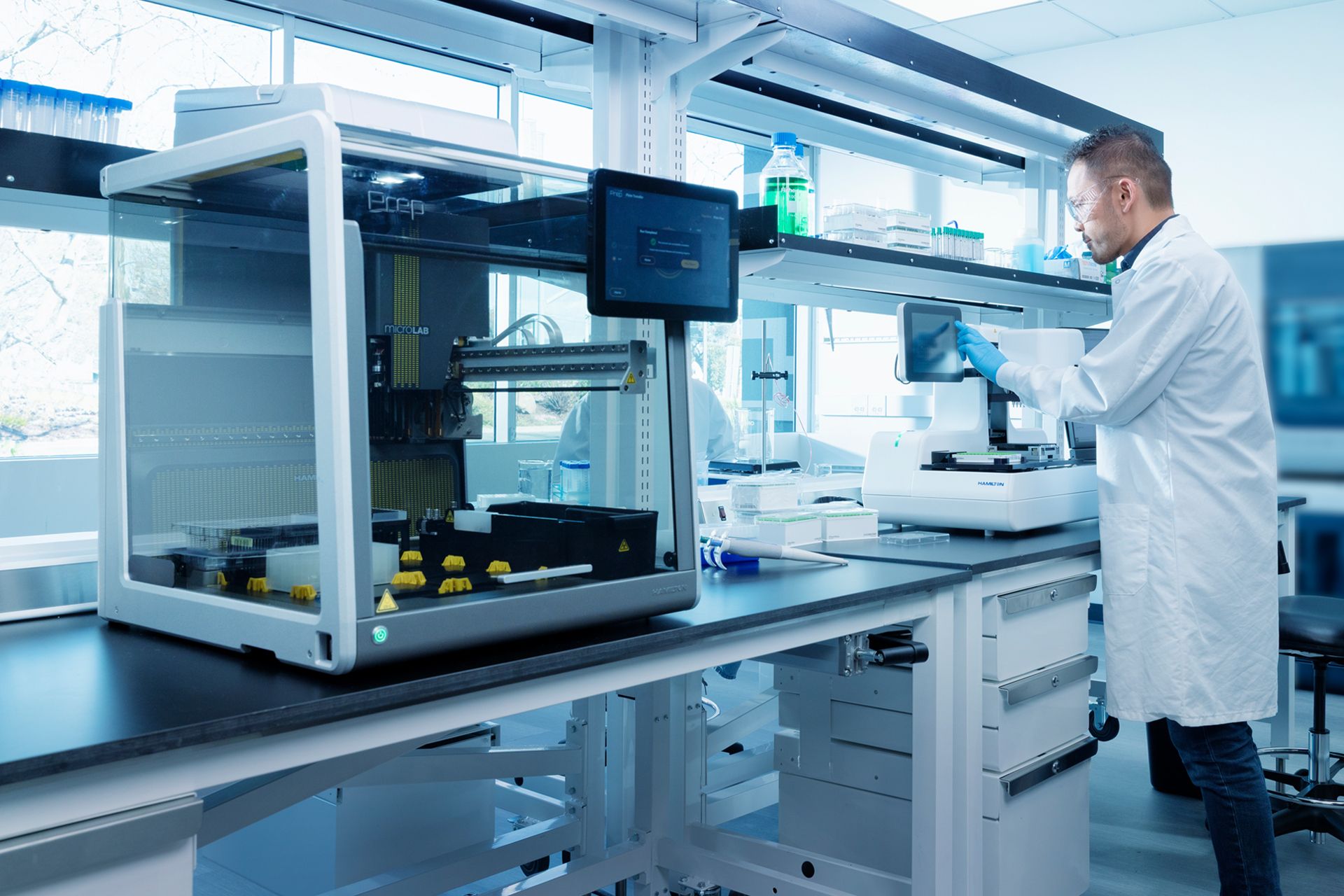 Scientist in a lab using a Hamilton laboratory product