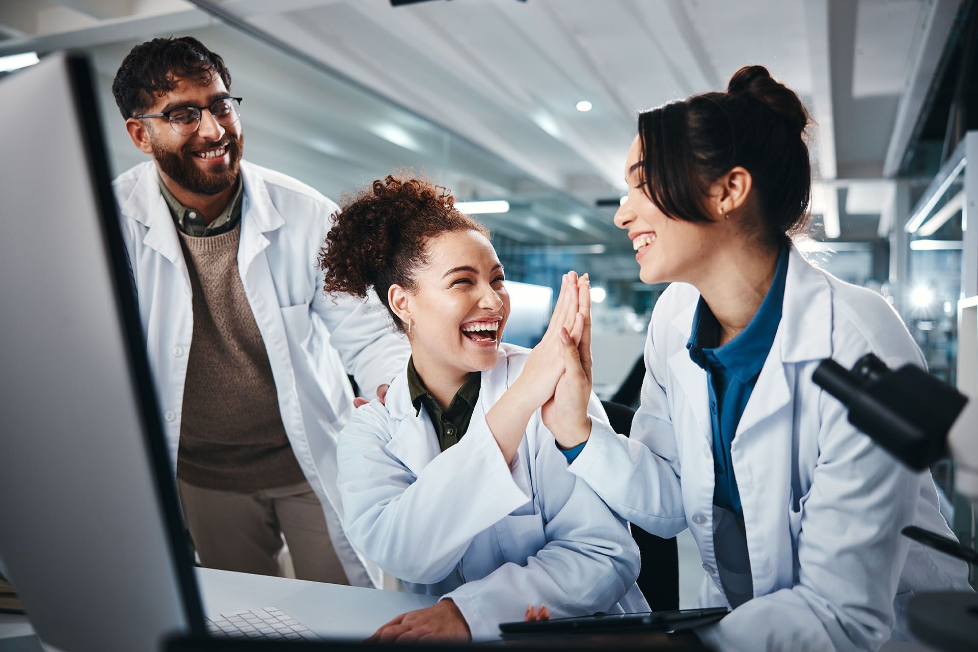 Excited scientists in a lab