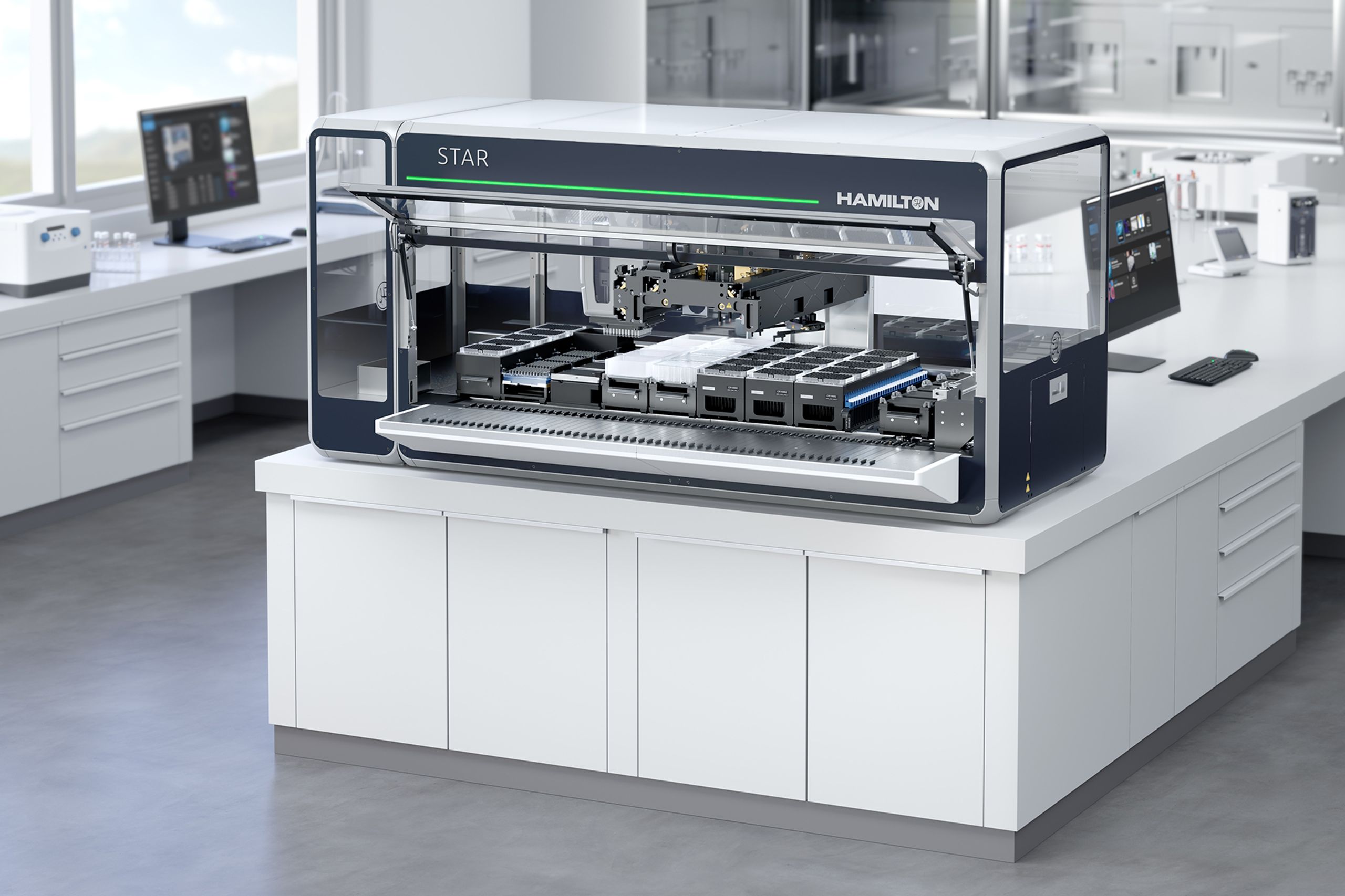Hamilton STAR automated liquid handler with open deck showing pipetting arm, labware, and reagent modules in a lab setting