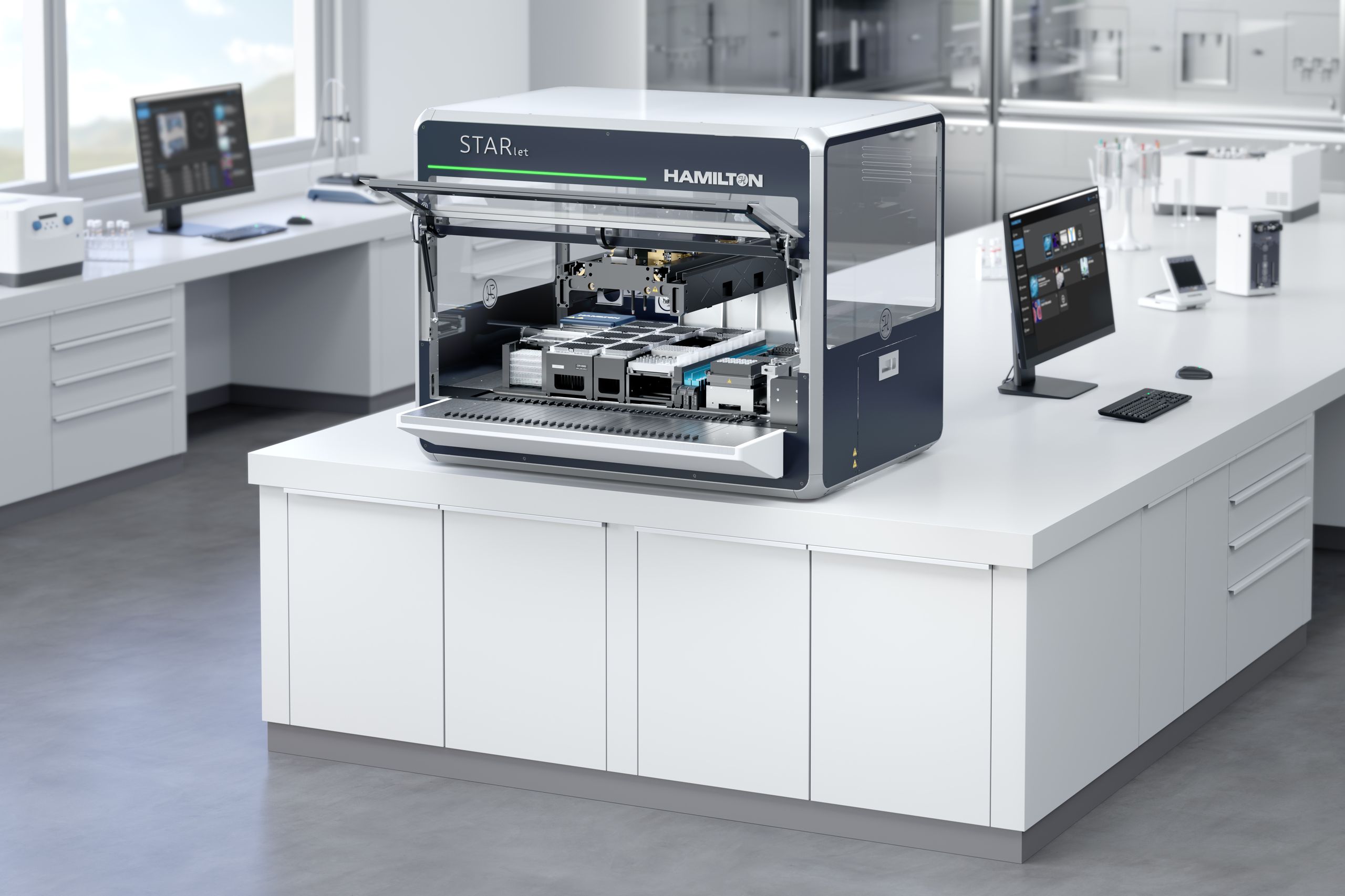 Hamilton STARlet automated liquid handler open lid showing deck with labware, in a laboratory setting