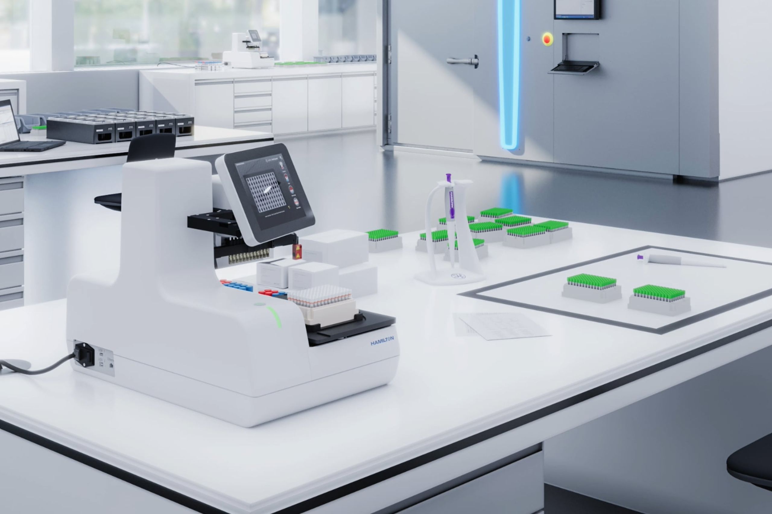 Hamilton lab decapper instrument with touchscreen beside green-capped tube racks on white laboratory bench