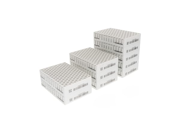 Three white Hamilton RackWare sample storage racks of varying heights, stacked and labeled with barcodes.