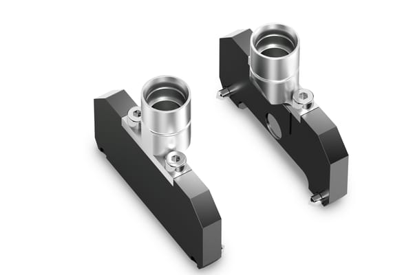 Two machined metal CO-RE II paddle components with cylindrical aluminum inserts and hex fasteners, shown on white background.