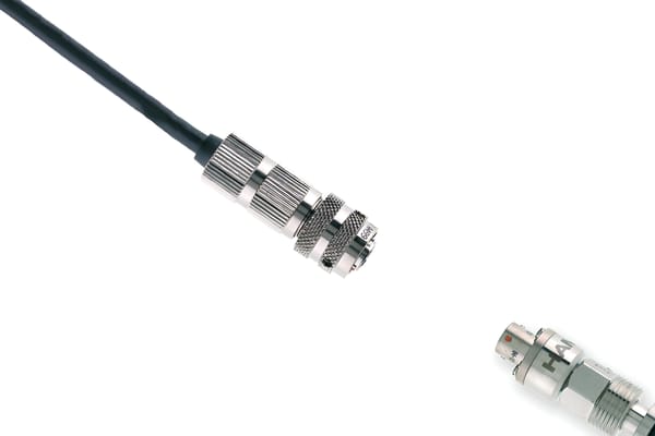 Metal sensor cable connector with knurled coupling nut, attached to a black cable, alongside a panel-mount receptor