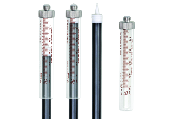 Four Hamilton Co. Gastight #1005 5mL syringes shown assembled, disassembled, and empty against a white background.