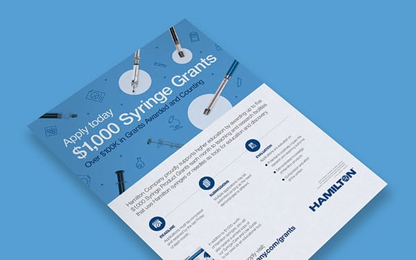 Angled flyer promoting Hamilton's $1,000 Syringe Grants program with syringes and lab icons on a blue background.