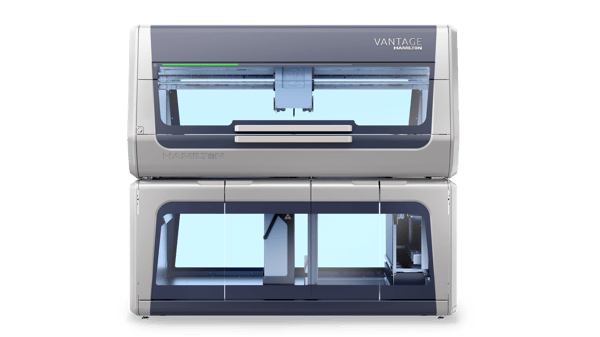 Hamilton Vantage automated liquid handler, front view, two-unit stacked configuration, silver and dark gray enclosure, green status light