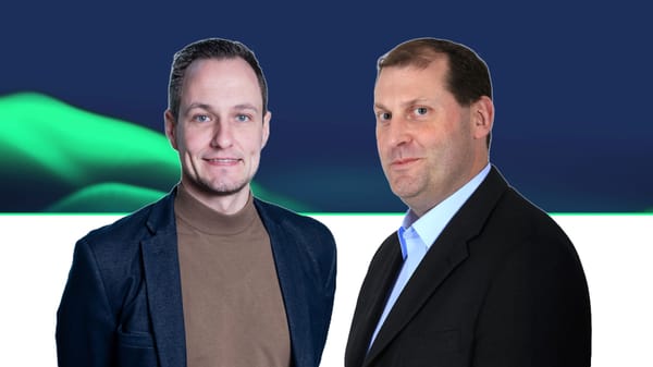 Two professionals in business attire against a dark blue background with green accent lighting.