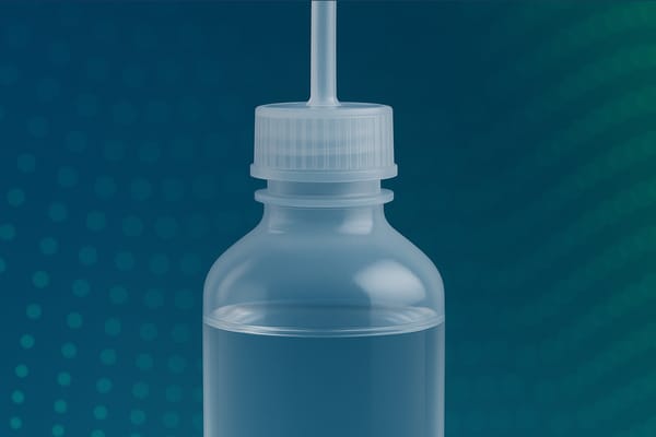 Translucent plastic wash bottle with screw cap and dispensing tube, partially filled with clear liquid