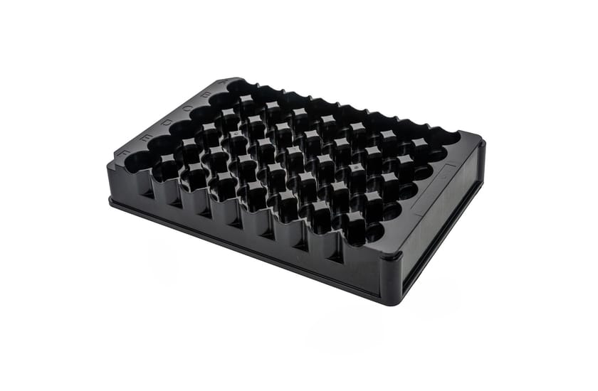 Black 48-well cap holder tray with labeled rows, molded plastic, on white background