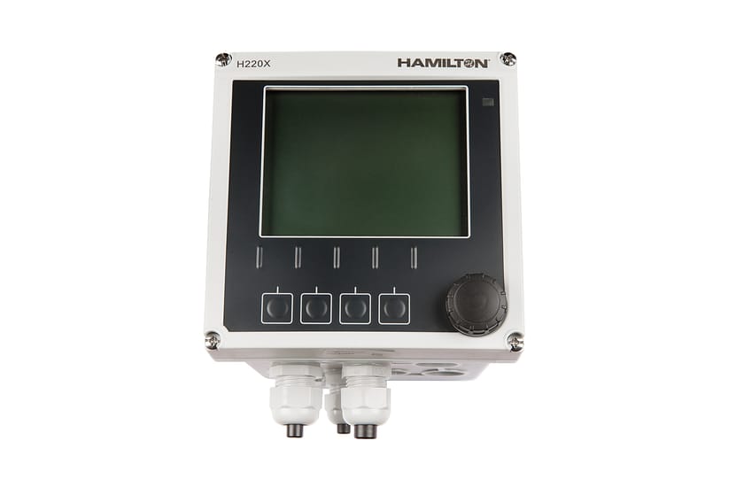 Hamilton H220X process transmitter with LCD display, four function buttons, rotary knob, and cable glands
