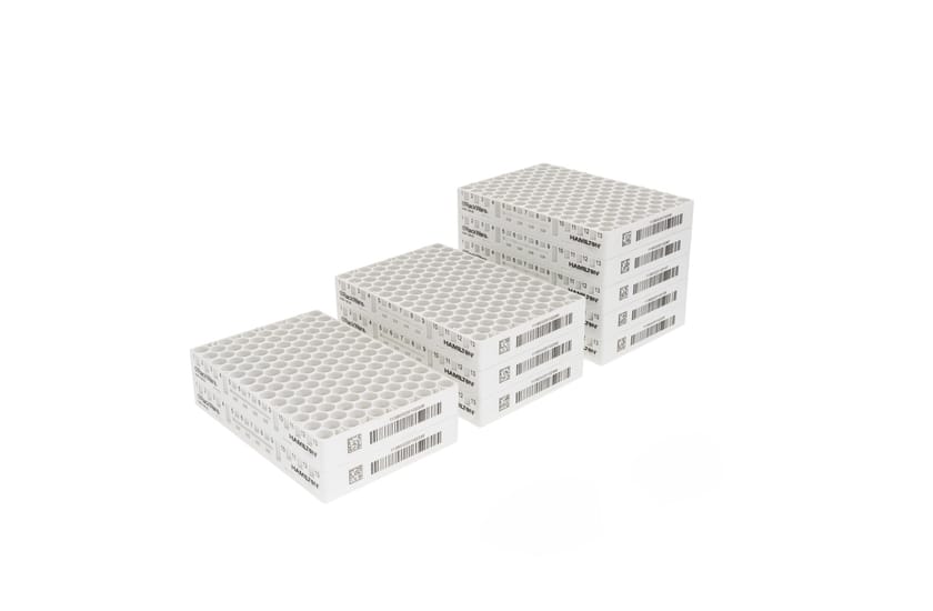 White Hamilton RackWare sample storage racks stacked in groups of 2, 4, and 6, with barcodes and grid labels visible.