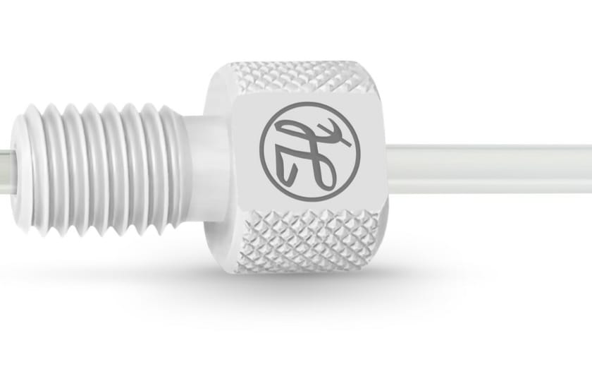 White flangeless fitting with knurled body and threaded ferrule, connected to clear tubing