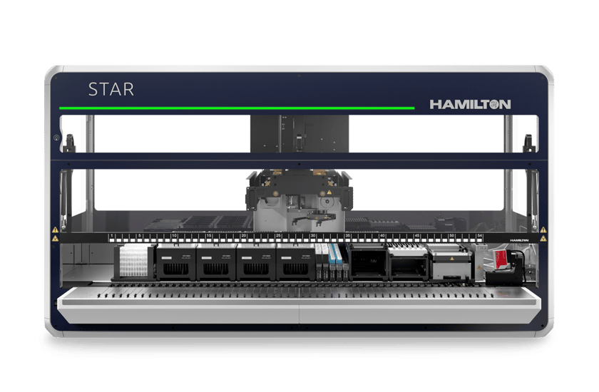 Hamilton STAR automated liquid handler with green status light illuminated, front view, deck loaded with labware