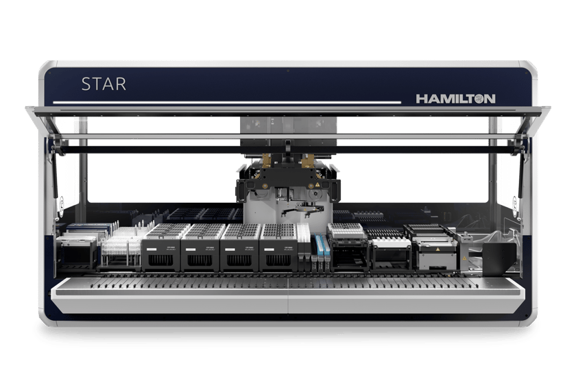 Hamilton STAR automated liquid handler, front view, deck loaded with tip carriers, plates, and reagent modules