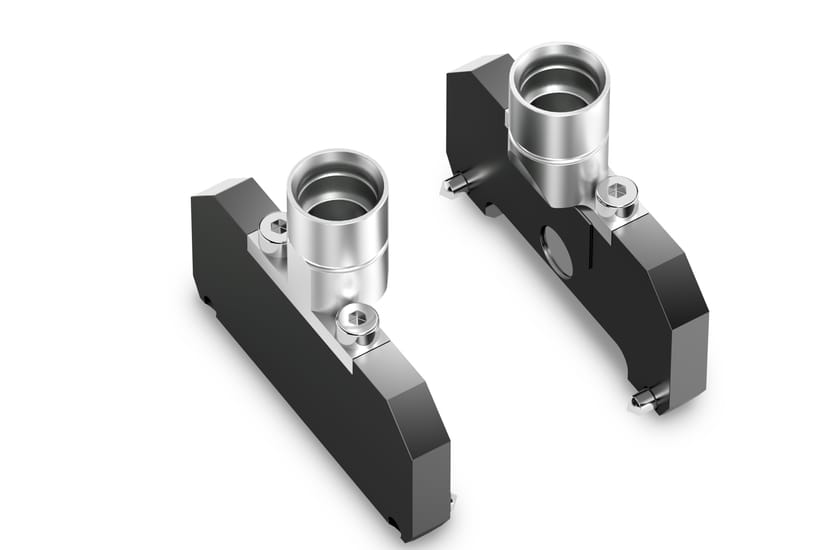 Two machined metal CO-RE II paddle components with cylindrical aluminum inserts and hex fasteners, shown on white background.