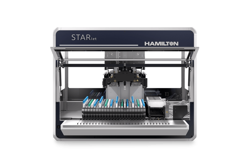 Hamilton STARlet automated liquid handler, front view, open deck loaded with pipette tip racks and microplates.