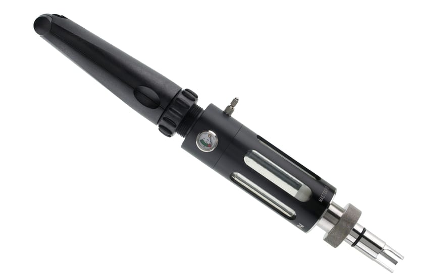 Black anodized syringe assembly with pressure gauge, fill slots, and stainless steel tip adapter