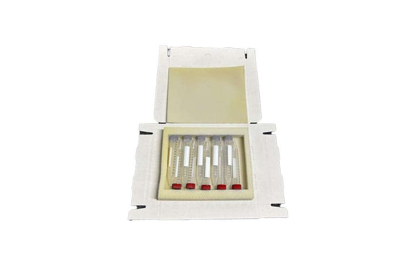 Open cardboard box with foam insert holding five small graduated vials with red caps and white labels
