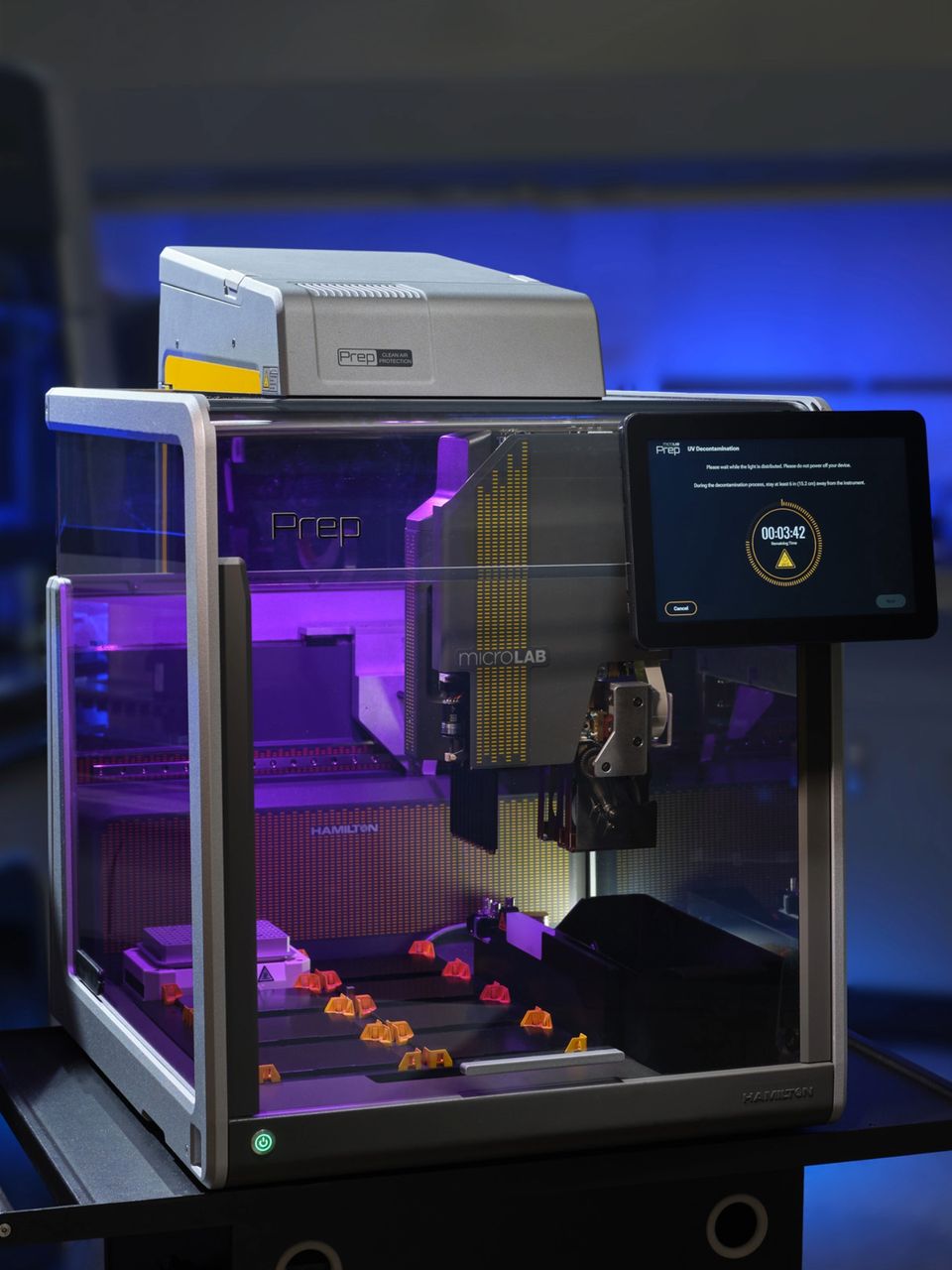 Hamilton microLAB Prep automated liquid handler running UV decontamination cycle, timer showing 00:03:42 on touchscreen