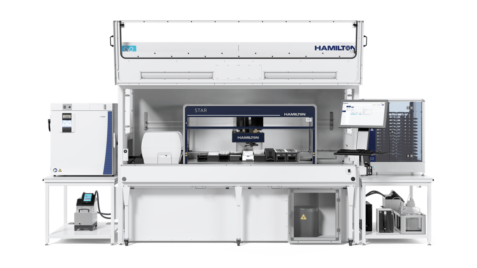 Hamilton STAR automated liquid handler in open Cell Care workstation enclosure with integrated monitor, storage, and peripherals