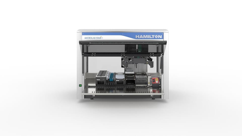 Hamilton Microlab STAR let automated liquid handling workstation with pipetting arm and deck loaded with labware