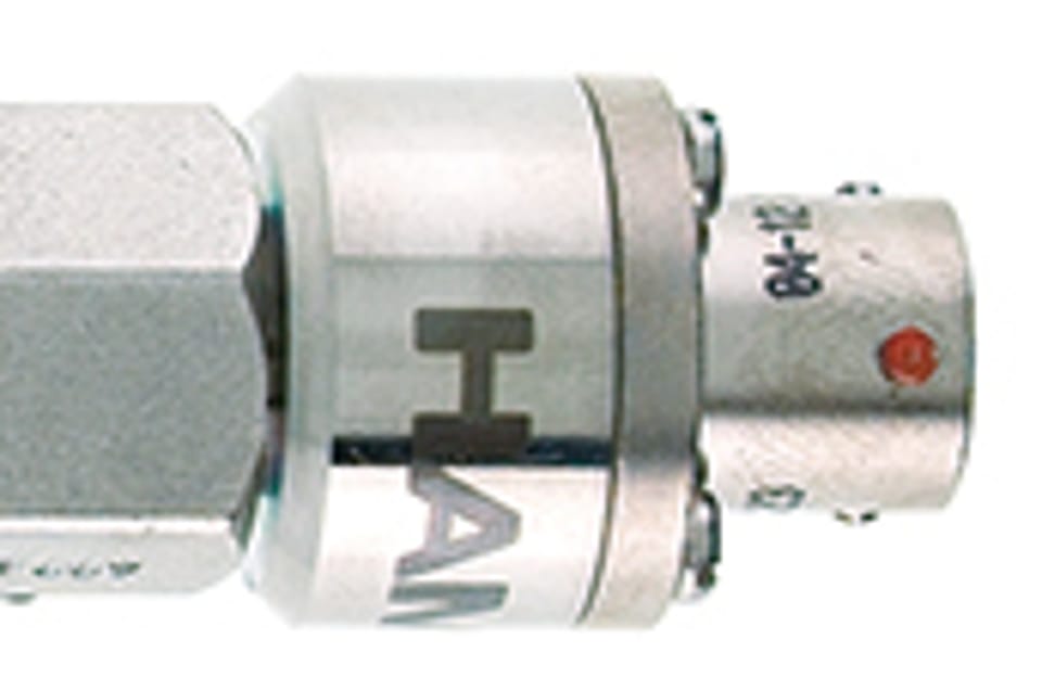 Close-up of a stainless steel fluid connector fitting with "HAMILTON" label visible